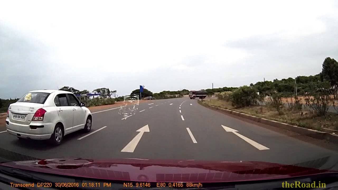 Car getting too close to a Lorry crossing the highway