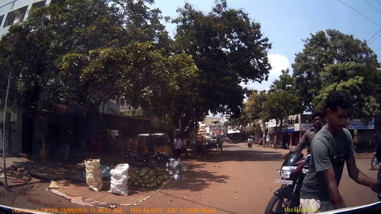 Car hitting a speeding Motorcycle crossing the road carelessly